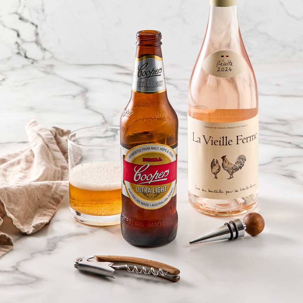 Wood Bottle Opener and Bottle Stopper next to wine & beer - MyHouse