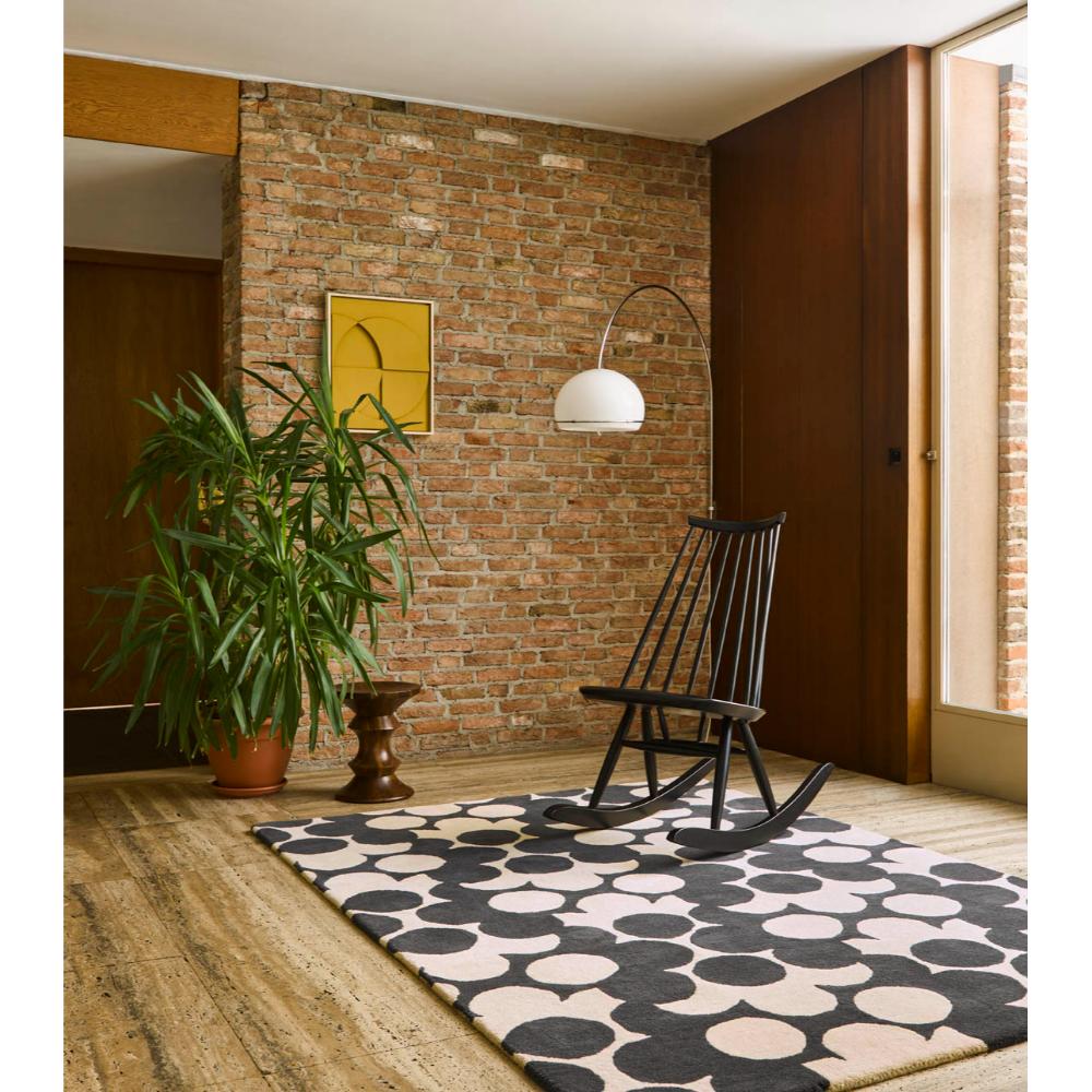 Grey and white flower rug with wooden rocking chair - MyHouse