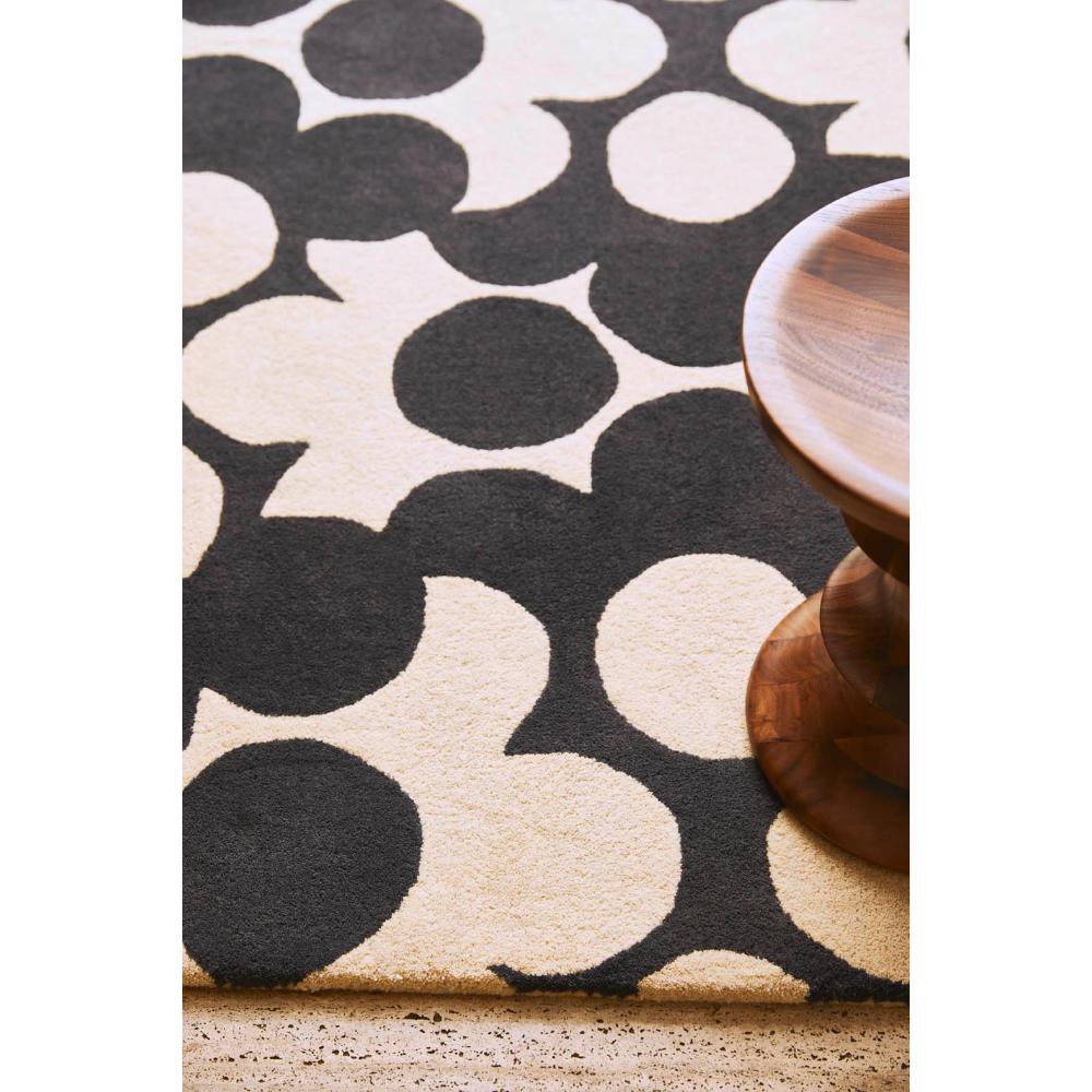 Grey and white flower rug with wooden stool - MyHouse
