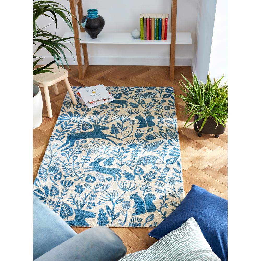 blue printed woodland creatures wool rug in sitting room - MyHouse