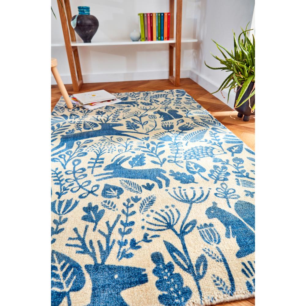 blue printed woodland creatures wool rug in sitting room - MyHouse