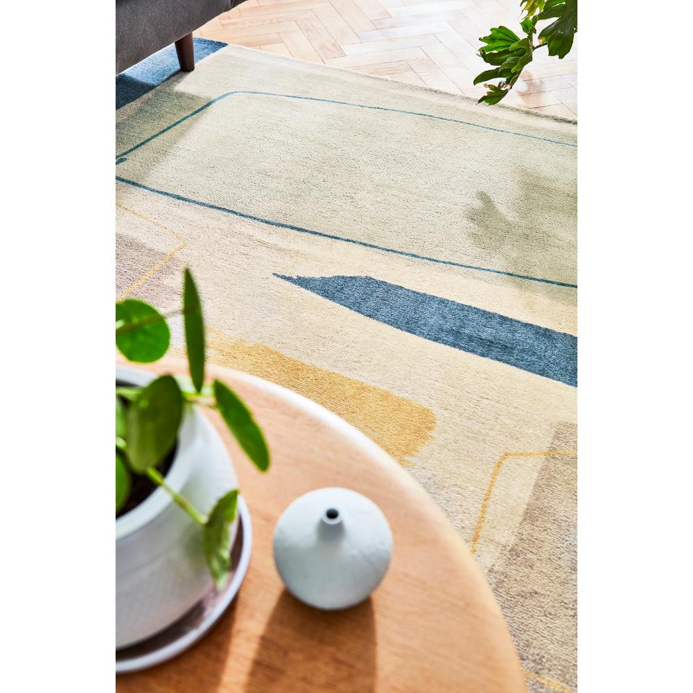 multicolour abstract blocks wool rug in sun drenched room - MyHouse