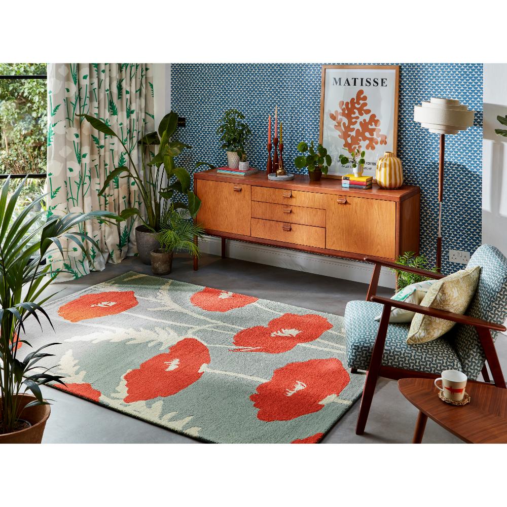 sage wool rug with red poppies in sitting room - MyHouse
