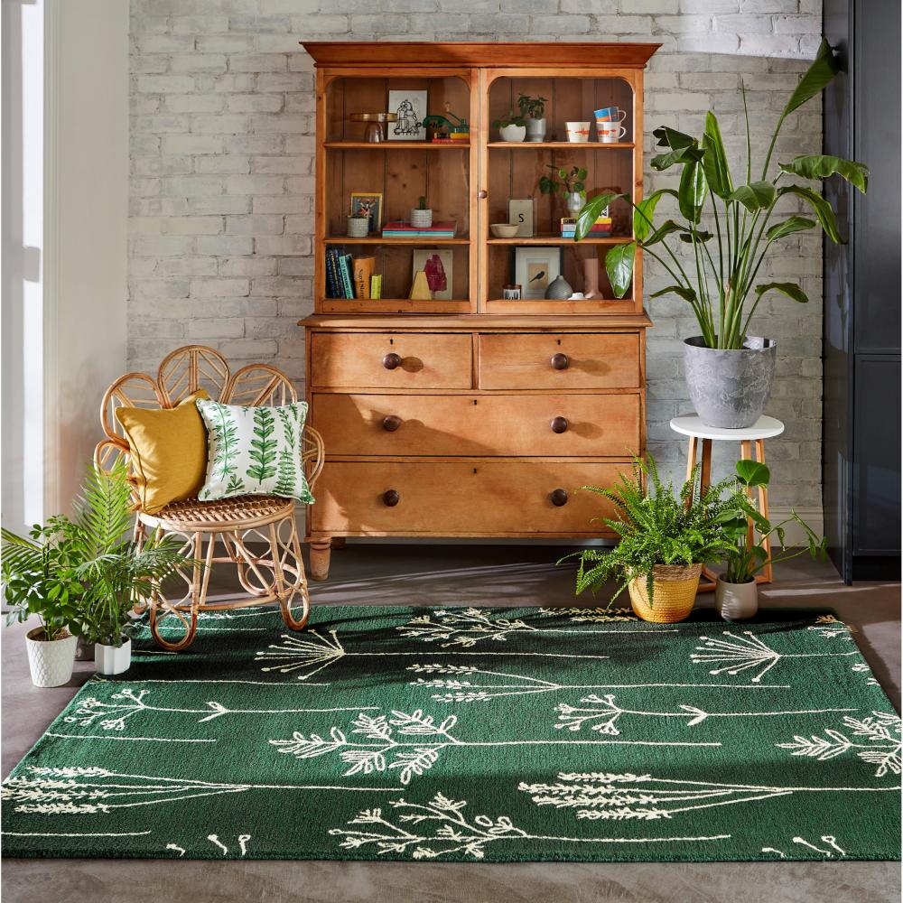 green flower stem wool rug with plants and sitting room - MyHouse