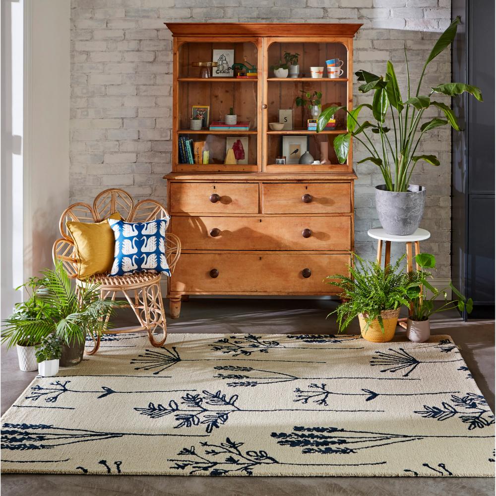 blue flower stem wool rug with plants and sitting room - MyHouse